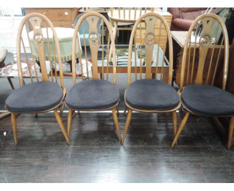 A set of 4 mid to dark stain Ercol drop leaf swan back dining chair