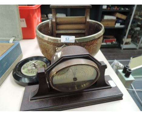 A 1930's phenolic bakelite case barometer by Thorpe, Nottingham, an early 20th century toy roulette wheel, an oak and plated 