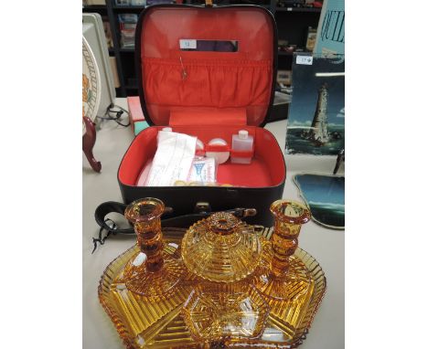 A selection of dressing table items including vanity case and pressed glass table set