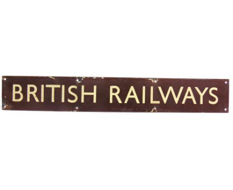 A BRITISH RAILWAYS (WESTERN REGION) ENAMEL SIGN, 'BRITISH RAILWAYS'  with cream lettering against a brown ground, 10.5cm x 68