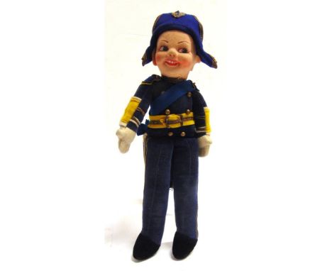 A NORAH WELLINGS CLOTH ADMIRAL DOLL  with a blue uniform, yellow belt and cuff facings, and a blue sash, labelled to right fo