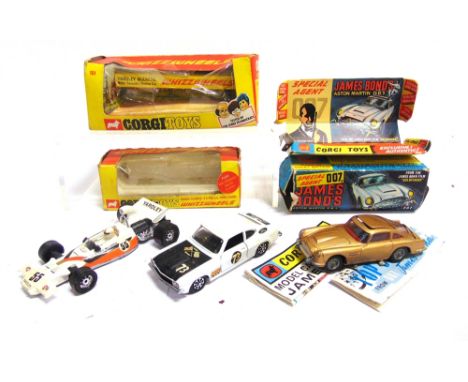 THREE CORGI DIECAST MODEL VEHICLES  circa 1960s-70s, comprising a Corgi No.261, James Bond Aston Martin DB 5, gold, good to f