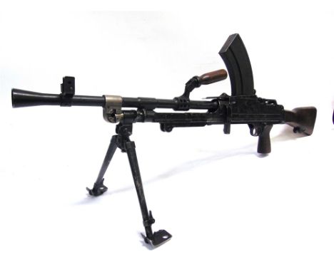A BRITISH BREN MK III .303 LIGHT MACHINE GUN, BY ENFIELD, 1955 deactivated, the blackened body with impressed serial number '