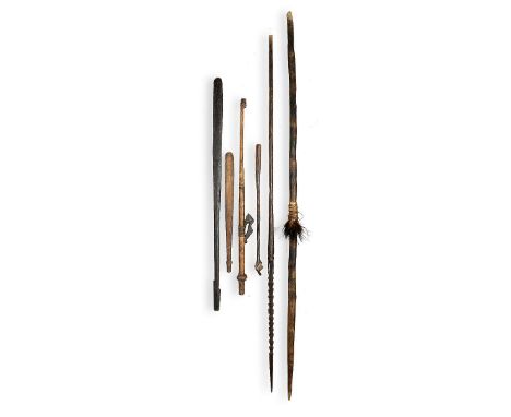 Tribal: A group of clubs, spear and tools  the largest 165cm.; 65ins 