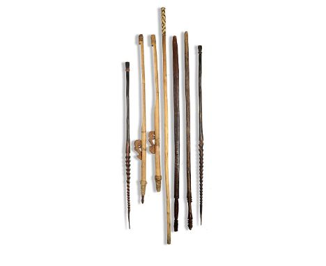 Tribal: A collection of seven wooden spears and tools  the largest 145cm.; 57ins