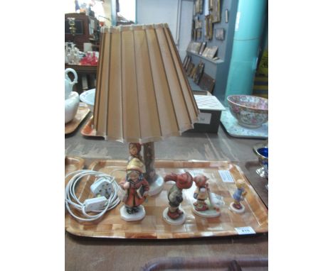 Three West German Hummel figurines, together with a Hummel table lamp with shade decorated with a young girl on branch, toget