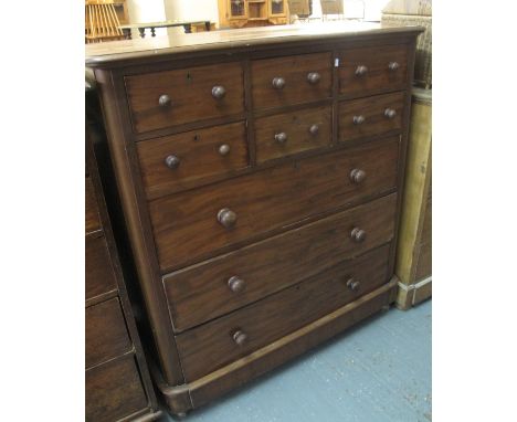 19th Century mahogany Scotch type chest having an arrangement of small and large drawers with turned handles on associate cas