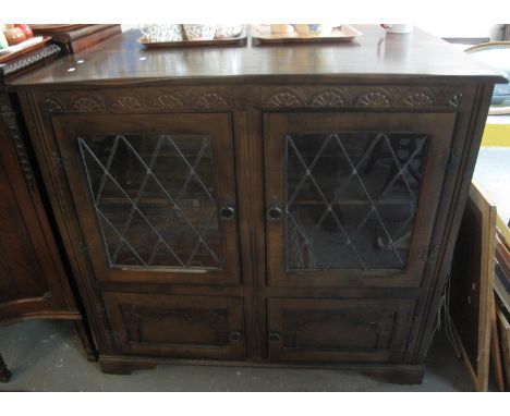 Mid Century oak Old Charm style astragal leaded glazed display cabinet on bracket feet. (B.P. 21% + VAT) 