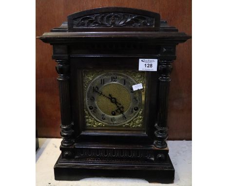 Early 20th century German carved  architectural three train mantel clock  having brass face  and silvered chapter ring 