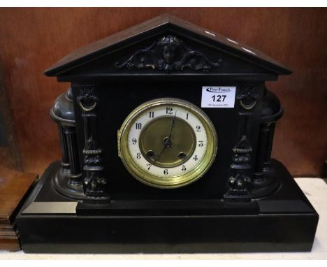 Late 19th/ Early 20th century architectural slate two train mantel clock having moulded mask head and pillared columns with b
