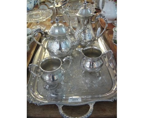 Four piece silver plated tea service, together with a two handles silver plated tray decorated with flowers and foliage. (B.P