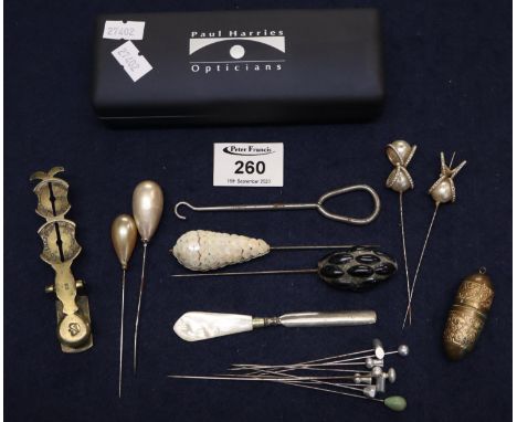 Engraved brass thread holder, sovereign scales and a collection of hat pins.  (B.P. 21% + VAT) 