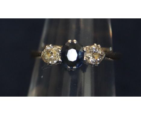 18ct gold, diamond and sapphire three stone ring. Ring size K. Approximate weight 2g. (B.P. 21% + VAT)very minor scuffs/wear 