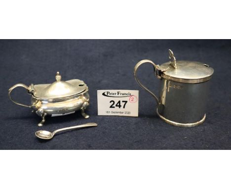 Silver mustard pot with hinged lid and blue glass liner, Chester hallmarks. Together with another silver mustard pot and spoo