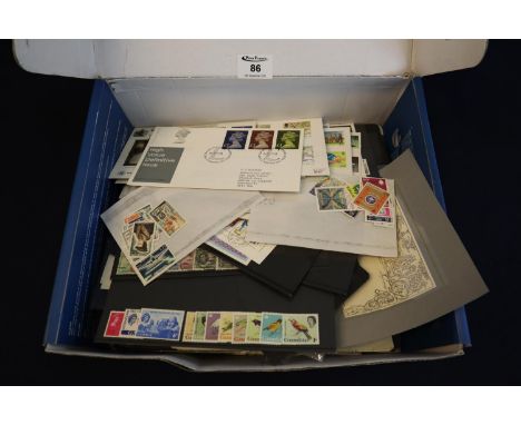 All world collection of stamps on pages, cards and in packets and various first day covers in blue box. Many 100's of stamps.
