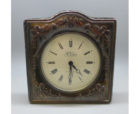 A silver fronted clock 