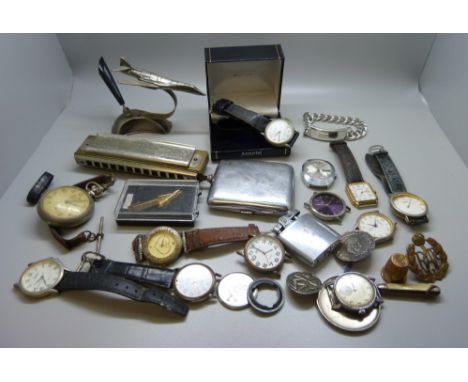 Mixed wristwatches, a jet aircraft pen holder, a Hohner harmonica, etc. 