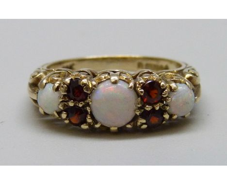 An antique style 9ct gold, opal and garnet ring, 2.7g, K 