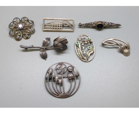 A collection of seven silver Art Nouveau style brooches 