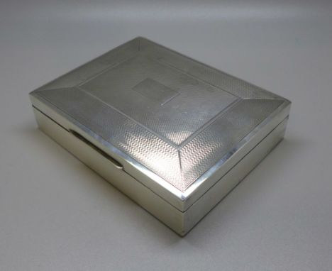 A silver engine turned cigarette box, cedar lined, Sheffield 1935, Viners Ltd, 235g 