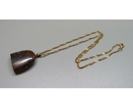 A 9ct gold chain with boulder opal pendant on a 9ct gold loop 