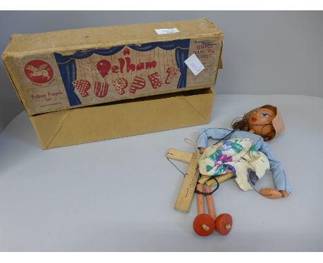 A boxed Pelham puppet of a girl 