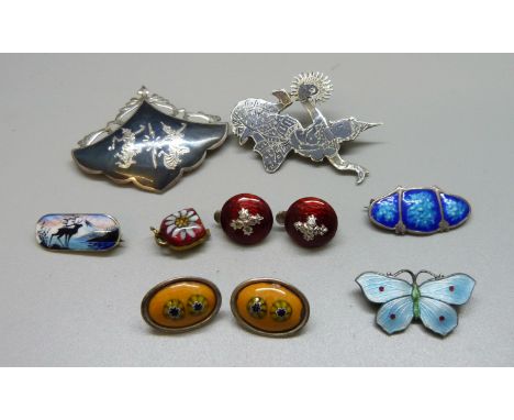 A collection of enamel jewellery; Norway silver brooch, butterfly brooch, a pair of ruby red enamel clip on earrings, enamel 