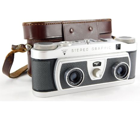 A Wray stereo graphic twin lens camera, in a leather case.