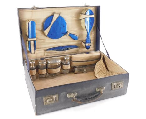 A mid 20thC travel or vanity case, of rectangular form with part fitted interior, to include jars with plated lids, hand mirr
