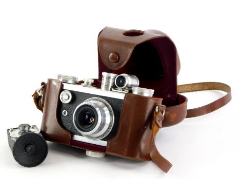 A Corfield Peroflex 1 camera, with a f3.5 Resolux lens, in a leather case, and a vintage Corfield Extinction exposure meter. 