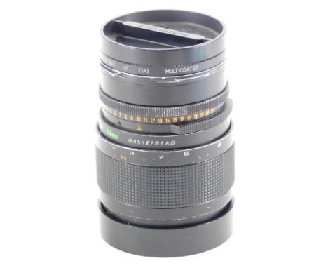 A Carl Zeiss Sonnar 150mm f4 lens, number 6559071, for a Hasselblad camera, with Hasselblad branding, etc.