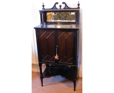 A late Victorian side cabinet, with blind fret and blind astragal glazed decoration mirror top, cluster column supports and u