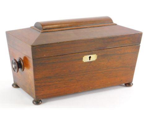 A Victorian rosewood tea caddy, of sarcophagus form, with two domed top compartments and mixing jar, with key, 37cm wide. 