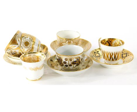 Various early 19thC English Coalport porcelain tea cups and saucers, decorated in gilt and white. (12)