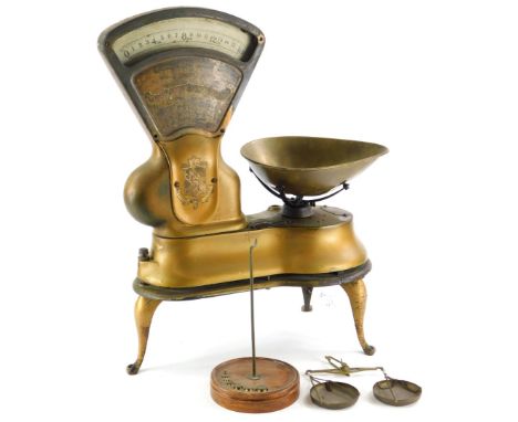 A set of W &amp; T Avery Limited scales, with gilt decoration, enamel style register etc., 36cm wide, and a set of stained be