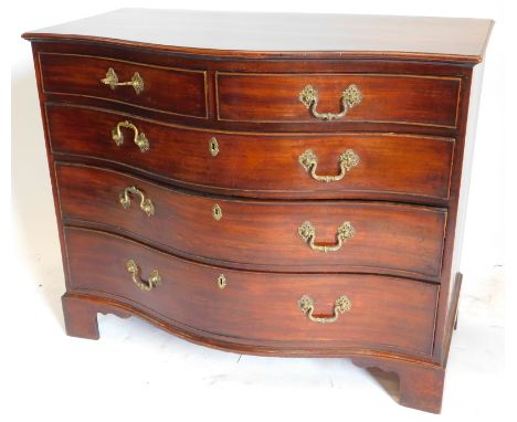 A George III mahogany serpentine chest, of two short and three long graduated drawers, oak lined and cock beaded with brass c