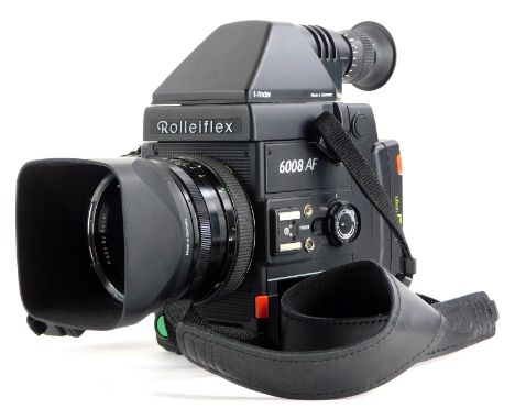 A Rolleiflex 6008AF camera, with Zeiss Planar f2.8 50mm lens, Pentaprism and handgrip.