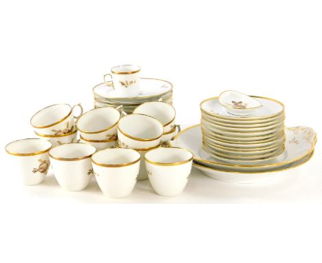 A Royal Copenhagen part service, circa 1922, decorated with flowers, with gilt highlights, to include serving plates, 28cm wi