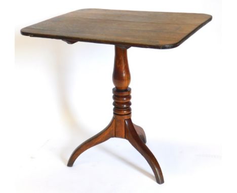 A 19thC oak occasional table, the rectangular top with rounded corners, on a turned column and tripod base, 71cm high, the to