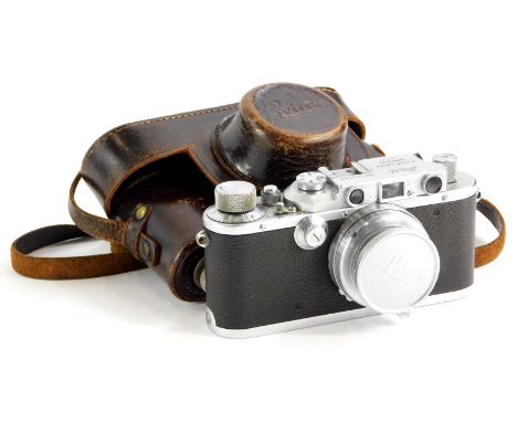 A Leica III camera, serial number 163566, with a Leitz 5cm f2 Summar lens, number 403494, in a leather case.