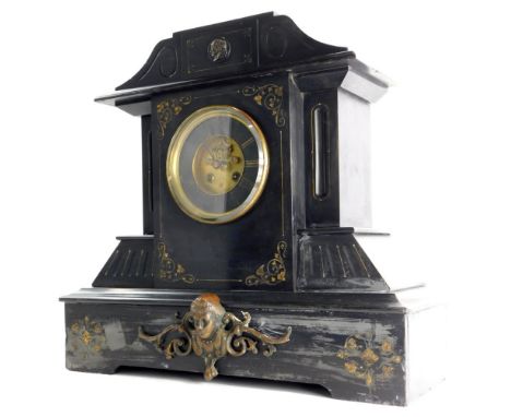 A late 19thC French black slate and bronzed metal mantel clock, decorated with Neoclassical masks, foliate scrolls, with a be
