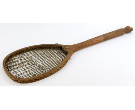 An early 20thC tennis racket, stamped Piggot and Co Bishops Gate, with fishtail handle, 68cm long.