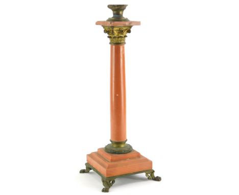 A red variegated marble and gilt metal table lamp base, (AF), 48 cm high.