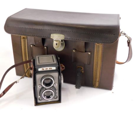 A French SEM twin lens reflex camera, 6 x 6 negative size, with 75mm F3.5 Berthiot lens and a 1960s Japanese carrying case.