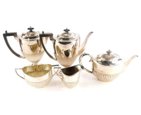 A matched five piece tea/coffee service, with half ribbed body comprising two handled sugar bowl, London 1889, 10oz, teapot, 