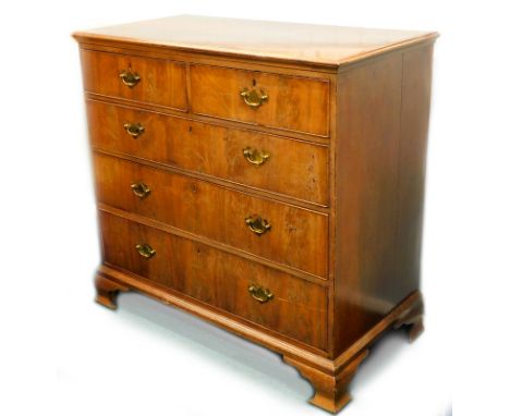 A 19thC flame mahogany chest, of three long and two short graduated drawers, with brass solid back plate handles, and ogee br