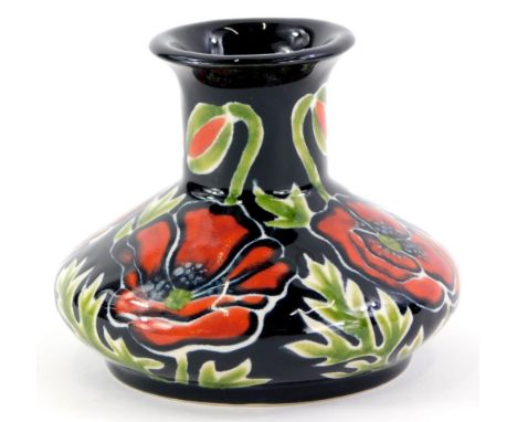 A Cobridge ceramic squat vase, decorated with poppies, in the manner of Moorcroft, impressed and printed marks to underside, 