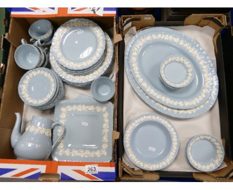 A large collection of Wedgwood Queensware dinnerware including - serving platters, dinner plates, cups, saucers, tea pot etc.