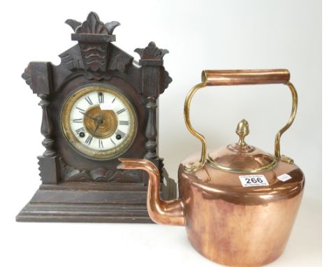 American mantle clock with oak surround and a brass and copper decorative tea pot. (2).
