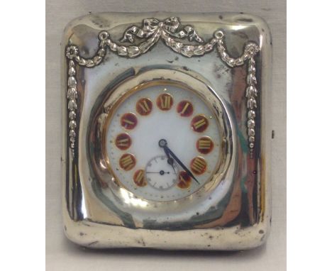 A Goliath Argentan chronograph travel clock with decorative silver fronted travel case. Case hallmarked Birmingham 1907 with 